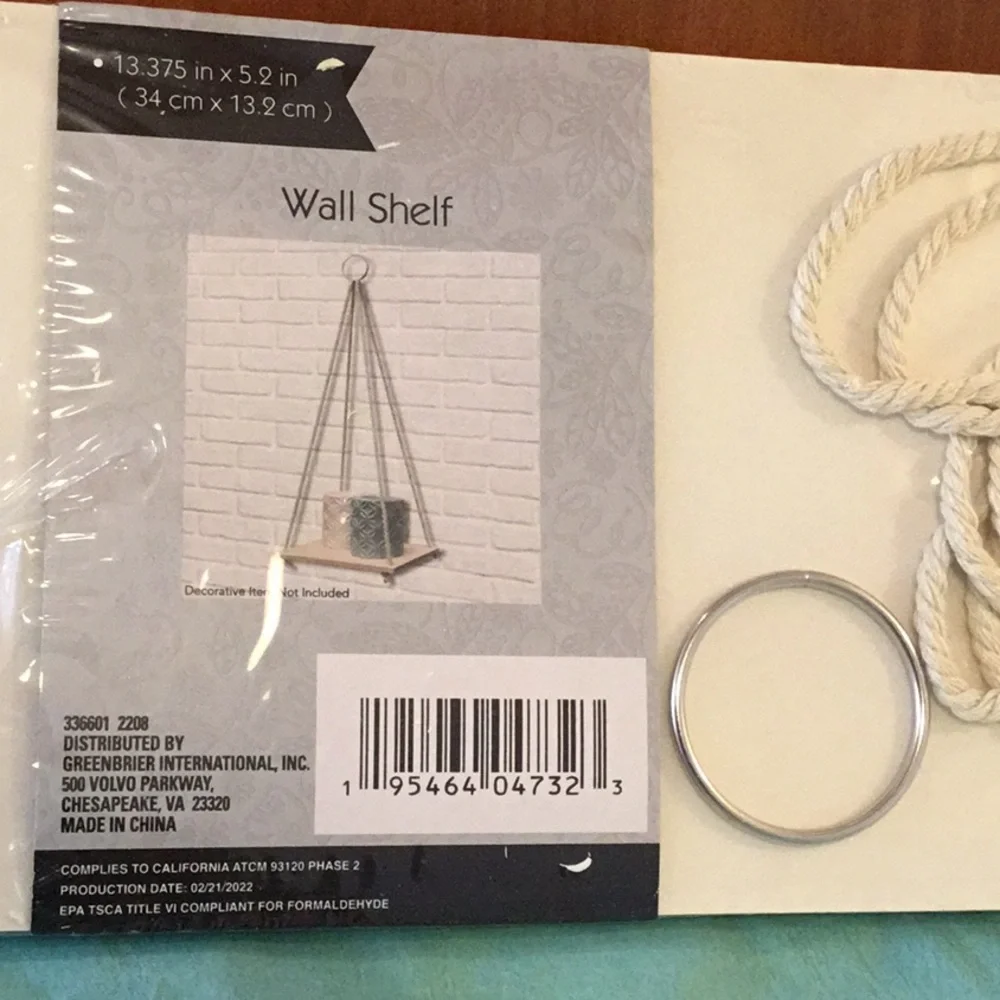 Hanging wall shelf. New in package